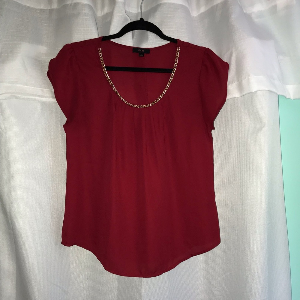 Red Blouse with gold necklace